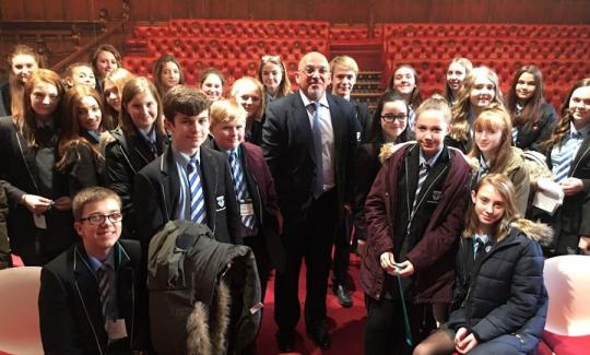 Nadhim Zahawi welcomes students from Alcester Academy to Parliament.